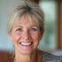 Portrait of Sarah M., 58, smiling warmly